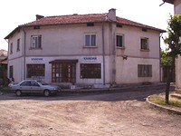 big house at the foot of a mountain