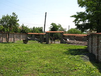 big garden with unfinished house