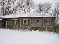 House With A Garage And A Large Garden